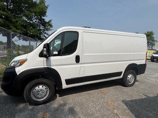 2023 Dodge ProMaster 3500; white, no branding; back is fully outfitted for animal transport